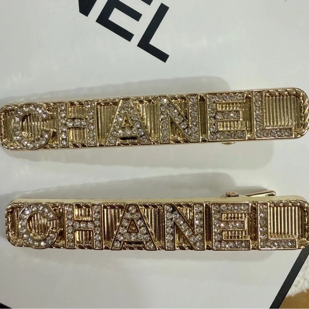 Compliments of CHANEL - 2 Gold Rhinestone Metal Hair Clips - New in bag